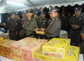 Royal Thai Police Commander-in-Chief Gen. Wichian Potphosri presents energy drinks to officers on duty.